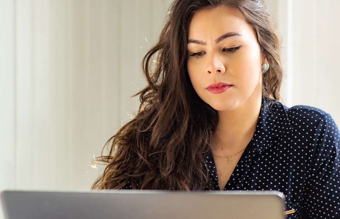 A team member running a deal through Celant on her laptop